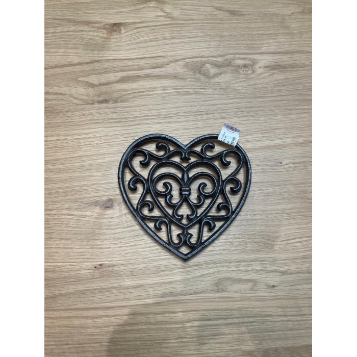 Le dessous de plat en fonte, cœur,